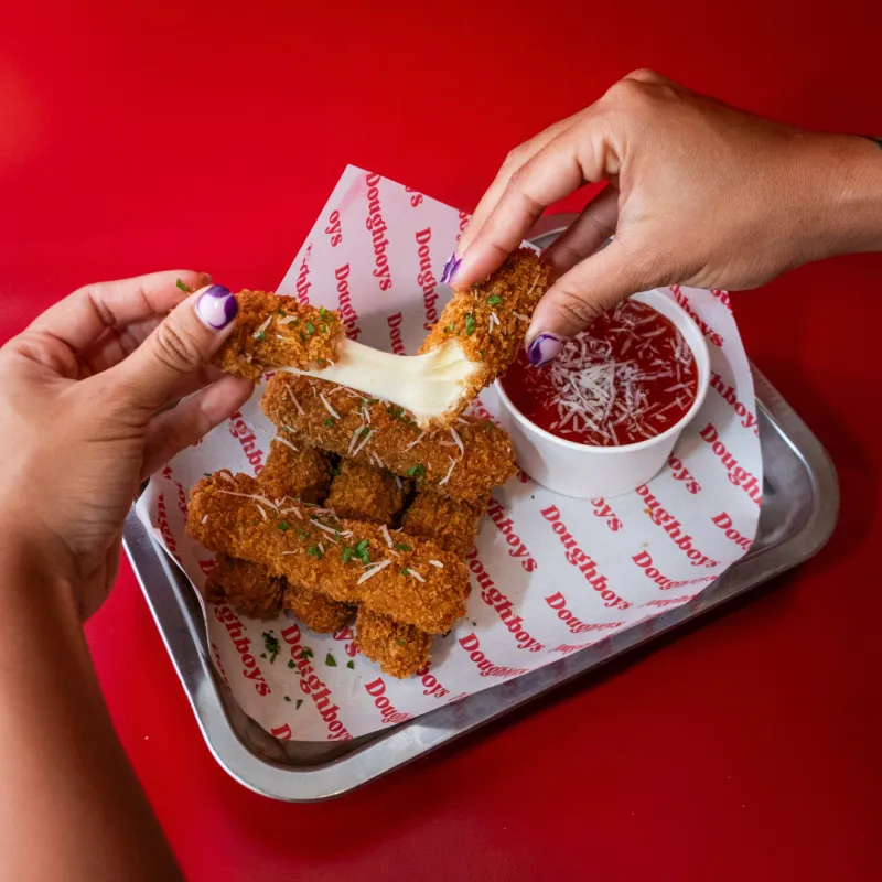 Crispy mozzarella sticks with marinara sauce